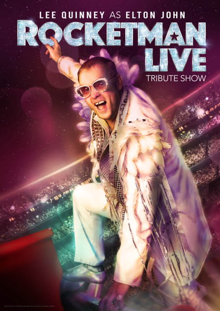Rocketman Live.Lee Quinney dressed as Elton performs in a large arena.